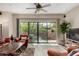 Sunlit living room showcasing sliding glass doors, wood-look floors, and comfortable seating at 20660 N 40Th St # 1118, Phoenix, AZ 85050