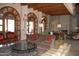 Inviting lobby space with wood beams, stone fireplace and comfortable seating at 20660 N 40Th St # 1118, Phoenix, AZ 85050