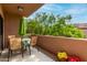 Enjoy outdoor living on this patio, featuring a dining area surrounded by lush, green landscaping at 20660 N 40Th St # 1118, Phoenix, AZ 85050