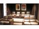 Private theater room featuring plush leather seating and acoustic paneling at 20660 N 40Th St # 1118, Phoenix, AZ 85050