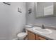 Cozy half bathroom with neutral decor and a simple vanity at 2116 S Shelby --, Mesa, AZ 85209