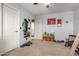 bedroom with open door to the bathroom, toys, and a ceiling fan at 2116 S Shelby --, Mesa, AZ 85209