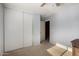 Bedroom with closet and door, with light streaming through the window, carpeted floor at 2116 S Shelby --, Mesa, AZ 85209