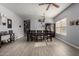Spacious dining area featuring a ceiling fan, modern light fixture, and dark wood dining set at 2116 S Shelby --, Mesa, AZ 85209