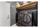 Laundry room features new large capacity washer and dryer on tile floor at 2116 S Shelby --, Mesa, AZ 85209