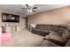 Comfortable living room featuring a large sectional sofa and entertainment center at 2116 S Shelby --, Mesa, AZ 85209