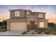 Attractive two-story home featuring a two-car garage and inviting front porch at 21255 E Cattle Dr, Queen Creek, AZ 85142
