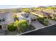 Aerial view of a single-Gathering home with lush landscaping and mature trees at 2166 N Steele --, Mesa, AZ 85207