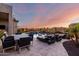 Backyard patio with dining table and lounge chairs with a swimming pool at 2166 N Steele --, Mesa, AZ 85207