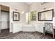 Luxurious bathroom with double vanities, a soaking tub, and elegant finishes at 2166 N Steele --, Mesa, AZ 85207