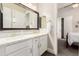 Modern bathroom with double sinks, white cabinets and a view to the bedroom at 2166 N Steele --, Mesa, AZ 85207