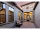 Inviting courtyard with a cozy cushioned bench and elegant brick paving at 2166 N Steele --, Mesa, AZ 85207