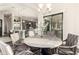 Elegant dining area with a round table, chairs, and view into the kitchen at 2166 N Steele --, Mesa, AZ 85207
