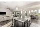 Open concept kitchen with granite island, farm sink, and seamless flow to living and dining areas at 2166 N Steele --, Mesa, AZ 85207