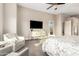 Relaxing main bedroom with neutral tones, a cozy sitting area, and large windows at 2166 N Steele --, Mesa, AZ 85207