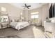Serene main bedroom featuring a king-sized bed, sitting area, and ample natural light at 2166 N Steele --, Mesa, AZ 85207