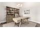 Bright office featuring a wooden desk, light walls, and a wall-mounted bookcase at 2166 N Steele --, Mesa, AZ 85207