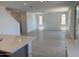 Bright, open-concept living room features neutral walls, tile flooring, and plenty of natural light at 22382 W Monona Ln, Surprise, AZ 85387