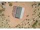 Aerial view of new desert home with natural desert landscaping for a peaceful environment at 2248 S Nikki Ln, Maricopa, AZ 85139