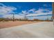 Expansive desert backyard showcasing native vegetation and clear blue skies at 2248 S Nikki Ln, Maricopa, AZ 85139