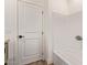 Crisp white tile surrounds the tub in the renovated bathroom at 2248 S Nikki Ln, Maricopa, AZ 85139