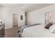 Relaxing bedroom featuring neutral carpet, closet, and access to the bathroom at 2248 S Nikki Ln, Maricopa, AZ 85139