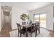 Bright dining area with modern table set and sliding glass door access to outdoor space at 2248 S Nikki Ln, Maricopa, AZ 85139