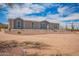 Single-story home featuring desert landscaping, seen from driveway with desert vegetation in background at 2248 S Nikki Ln, Maricopa, AZ 85139