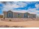 Charming single-story home featuring a well-maintained yard with desert landscaping and a welcoming entrance at 2248 S Nikki Ln, Maricopa, AZ 85139