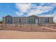 Charming single-story home featuring a well-maintained yard with desert landscaping and a welcoming entrance at 2248 S Nikki Ln, Maricopa, AZ 85139