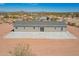 Desert home featuring neutral siding, gray roof, and a large concrete patio for relaxing and entertaining at 2248 S Nikki Ln, Maricopa, AZ 85139
