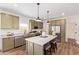 Modern kitchen with island, stainless steel appliances, and plenty of counter space at 2248 S Nikki Ln, Maricopa, AZ 85139