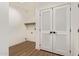 The laundry has a shelf, hookups, and unique double doors at 2248 S Nikki Ln, Maricopa, AZ 85139