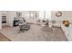 Bright living room features neutral decor, modern furnishings, and lots of natural light at 2248 S Nikki Ln, Maricopa, AZ 85139