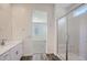Bright bathroom with walk-in shower, marble detail, and an opening into the bedroom at 25338 N 150Th Ln, Surprise, AZ 85387