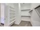 Bright closet with shelves and wood racks for storage at 25338 N 150Th Ln, Surprise, AZ 85387