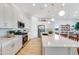 Modern kitchen with white cabinets, stainless steel appliances, and a large island perfect for entertaining at 25338 N 150Th Ln, Surprise, AZ 85387