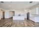 Beautiful open kitchen boasts stainless appliances, a center island, and white cabinets, perfect for entertaining at 25338 N 150Th Ln, Surprise, AZ 85387
