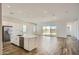 Spacious living area offers a large kitchen island and sliding doors to the backyard, ideal for indoor-outdoor living at 25338 N 150Th Ln, Surprise, AZ 85387