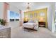 Serene main bedroom with ample natural light, neutral tones, and cozy furnishings for ultimate relaxation at 25338 N 150Th Ln, Surprise, AZ 85387