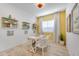 Charming office space with unique light fixture, desk, shelving, and wood-look flooring at 25338 N 150Th Ln, Surprise, AZ 85387
