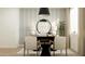 Bright home office space with a desk, chairs, modern lighting and decor at 25453 N 176Th Ave, Surprise, AZ 85387