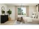 Bright main bedroom features a neutral color palette, modern lighting and stylish furnishings at 25453 N 176Th Ave, Surprise, AZ 85387