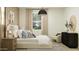 Comfortable main bedroom with natural light, plush bedding and contemporary decor at 25453 N 176Th Ave, Surprise, AZ 85387