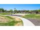 Outdoor basketball court surrounded by green grass and landscaping at 25617 W St James Ave, Buckeye, AZ 85326