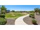 Serene community park featuring open green spaces and a winding pathway at 25617 W St James Ave, Buckeye, AZ 85326