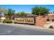 Community sign for Sunset Vista with mature landscaping and neighborhood homes in the background at 25617 W St James Ave, Buckeye, AZ 85326