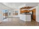 Open-concept dining room with sliding glass door access to the backyard and view into the kitchen at 25617 W St James Ave, Buckeye, AZ 85326