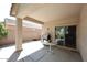 Covered patio with a view to the backyard, outdoor grill, and glass-top table at 2614 W Fawn Dr, Phoenix, AZ 85041
