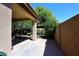This backyard has a covered patio and plenty of greenery at 2614 W Fawn Dr, Phoenix, AZ 85041